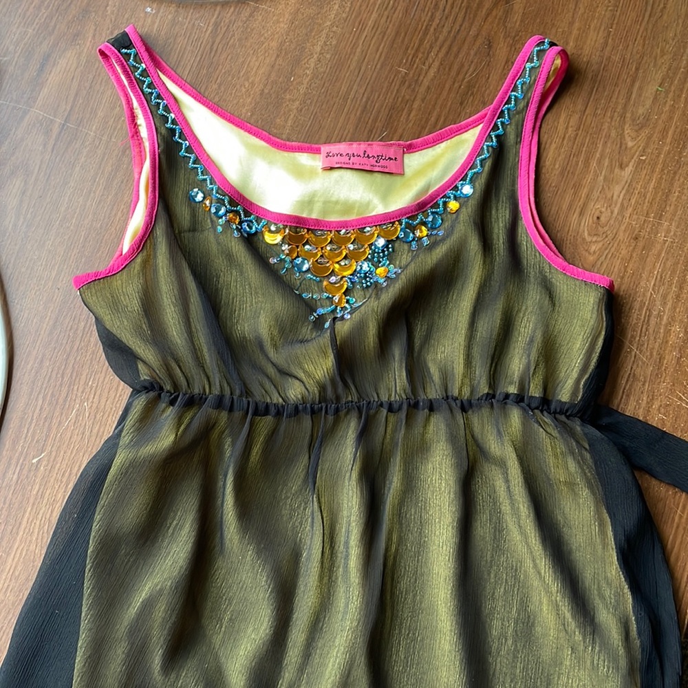 Beaded sleeveless top with back tie and black sheer overlay